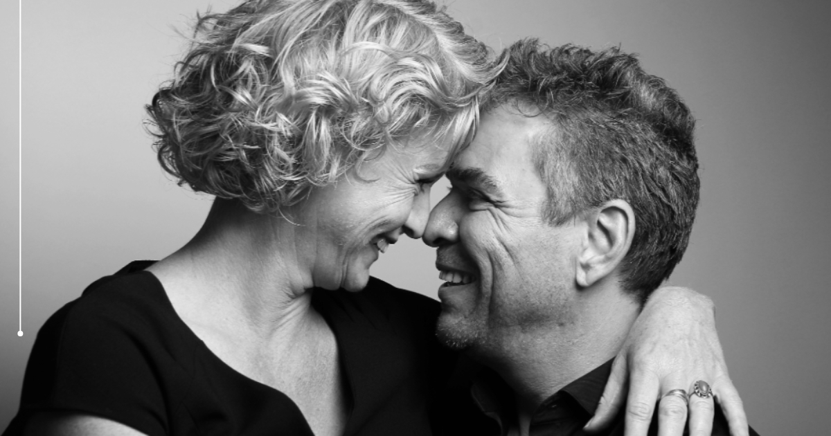 38 Aging Like Fine Wine_ Sex Tips for Your Best Years Yet - Mature Singles Finding Love Happy mature couple embracing and smiling affectionately, symbolizing intimacy, connection, and love in later life.