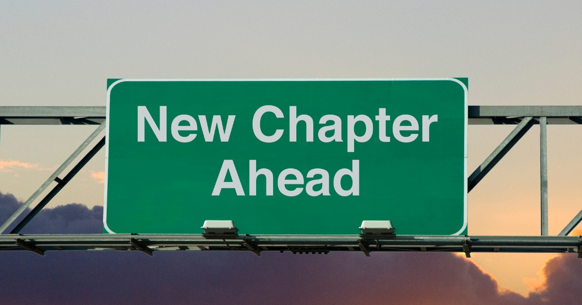 Green highway sign reading “New Chapter Ahead” symbolizing fresh starts, new beginnings, and life after midlife divorce.