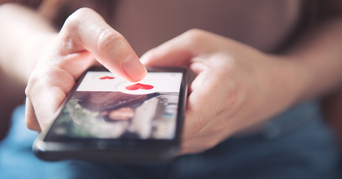 Are Dating Apps Only For Younger People - Mature Singles Finding Love Online dating app interface with heart icon on a mobile screen.