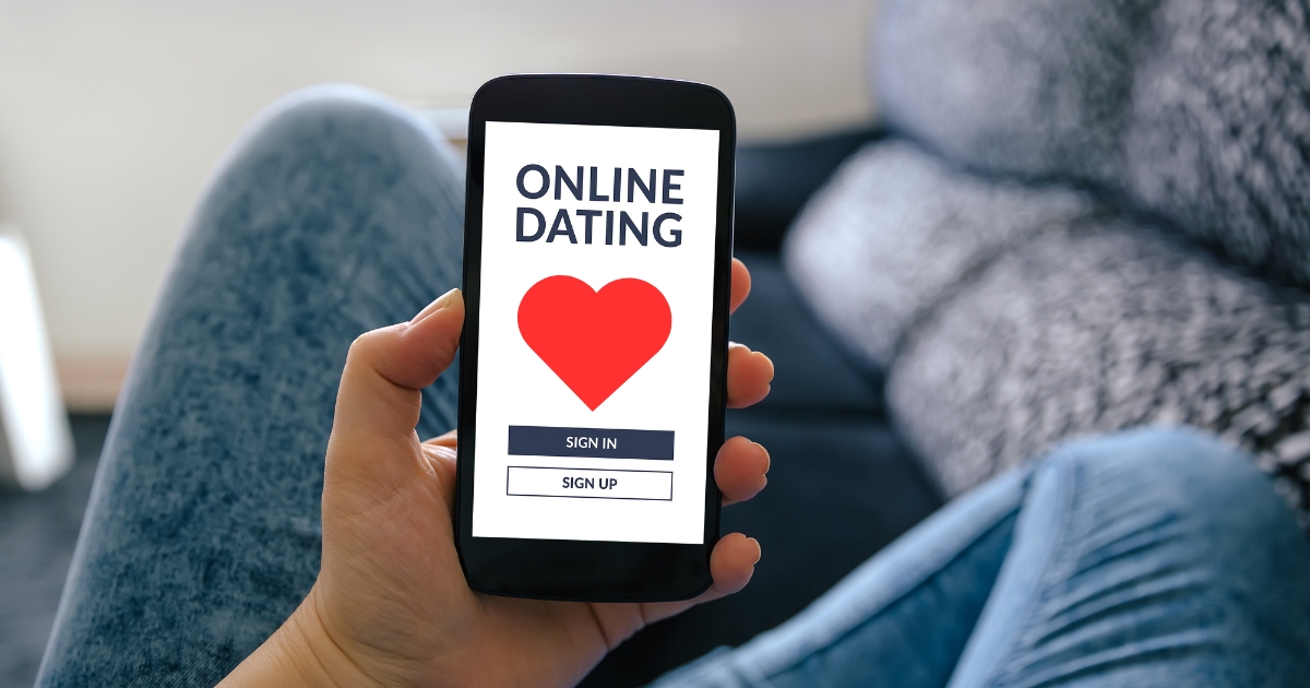 Are Dating Apps Right For You_ When Traditional Dating Might Be A Better Option - Mature Singles Finding Love Person holding smartphone with an online dating app login screen.