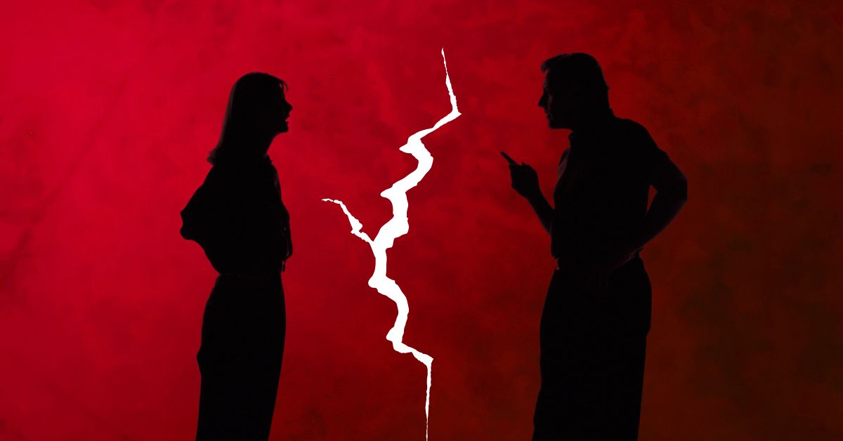 Silhouettes of a couple arguing with a crack between them, symbolizing relationship conflict