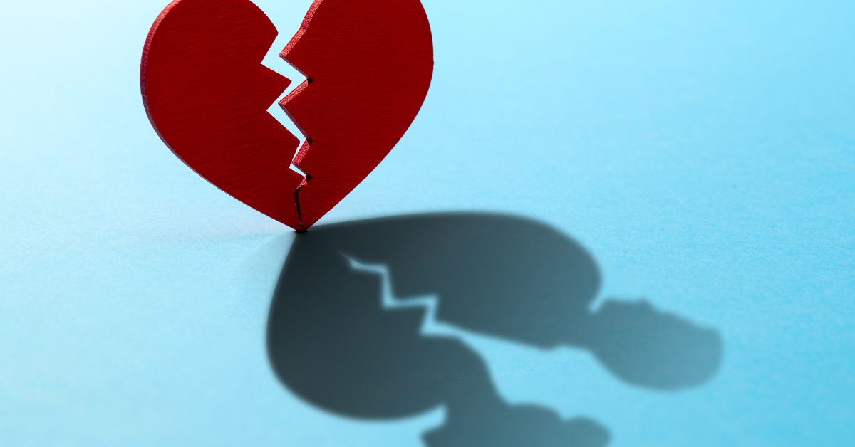Can You Recover From An Affair - Mature Singles Finding Love Broken red heart casting shadow of couple, symbolizing recovery from infidelity and relationship healing