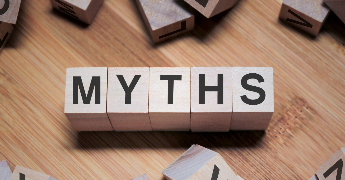 Common Myths About Love and Sexuality In Older Age - Mature Singles Finding Love Wooden blocks spelling out the word 'MYTHS' on a wooden surface, with scattered blocks around. The image represents the concept of debunking misconceptions and false beliefs.