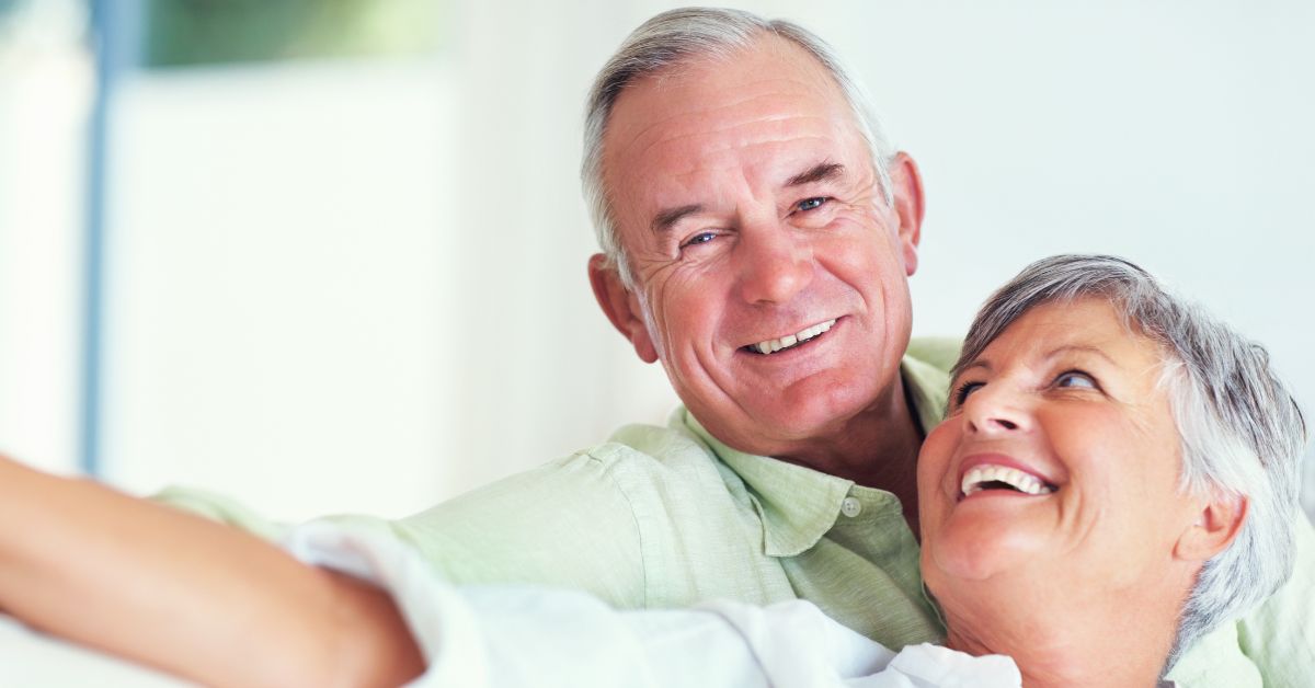 Couples Therapy_ Should You Try It - Mature Singles Finding Love Happy senior couple smiling and embracing, symbolizing a healthy relationship after couples therapy.