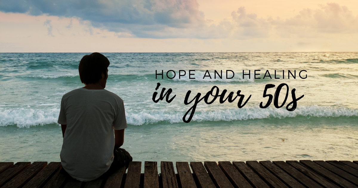 Dating After Loss_ Hope and Healing in Your 50s - Mature Singles Finding Love A person sitting on a wooden pier overlooking the ocean at sunset, with the text 'Hope and Healing in Your 50s' overlaying the serene scene, symbolizing reflection and renewal.