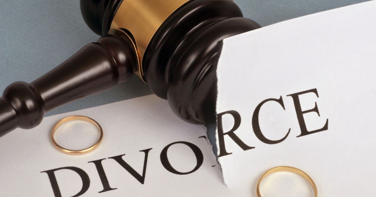 Dating Again_ How To Ease Back In After A Divorce - Mature Singles Finding Love Divorce decree with a gavel and wedding rings, representing legal separation and new beginnings.
