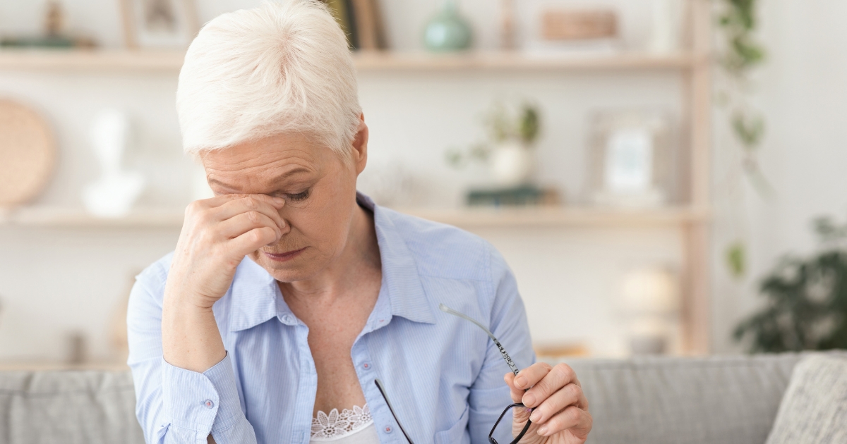 Feeling Tired All The Time_ THIS Could Be The Reason Why - Mature Singles Finding Love Older woman struggling with chronic fatigue and exhaustion at home.