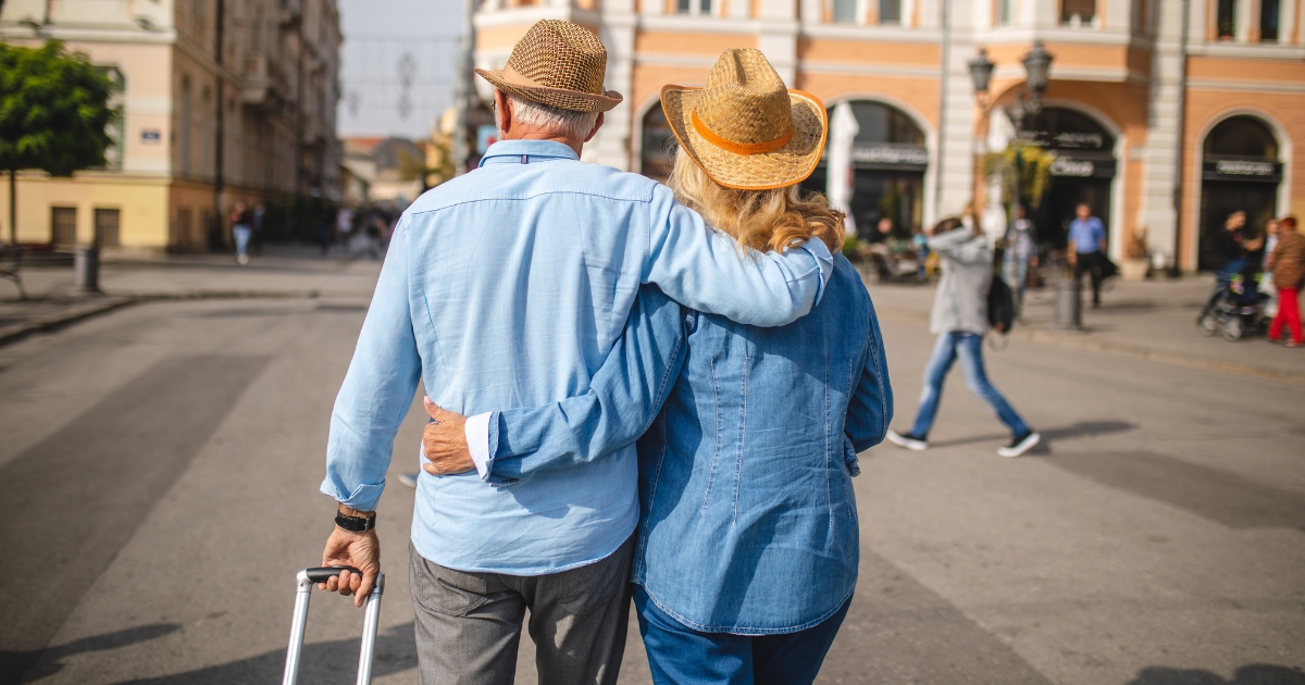 How Soon Should You Travel With A New Partner - Mature Singles Finding Love Senior travelers exploring a romantic destination, holding each other closely.