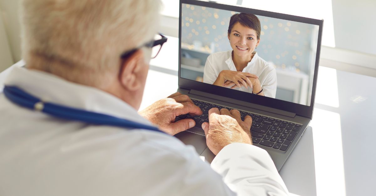 How Technology Can Help You Stay Connected and Find Love After 50 - Mature Singles Finding Love Senior man having a video call on a laptop with a smiling woman, illustrating how technology helps older adults stay connected and build relationships