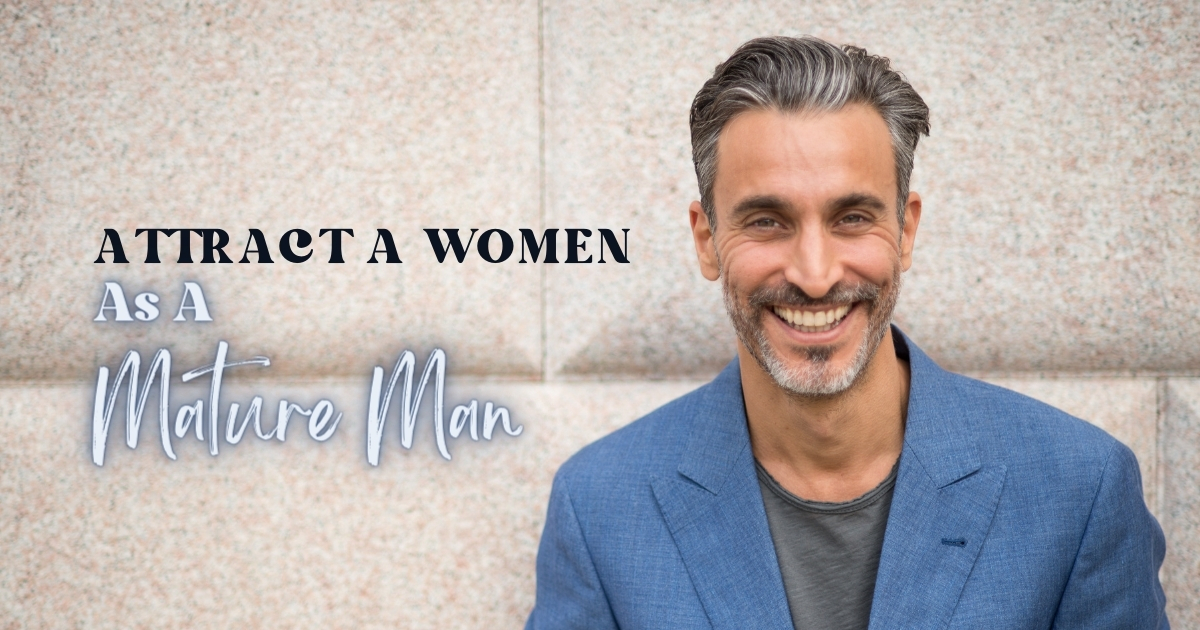 How To Attract A Women As A Mature Man - Mature Singles Finding Love Smiling mature man in a blue blazer standing against a stone wall with the text 'Attract A Woman As A Mature Man' in bold and cursive fonts.