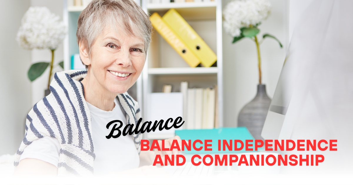 Smiling older woman sitting at a desk with text overlay reading “Balance Independence and Companionship,” representing healthy relationships and personal freedom for mature singles.