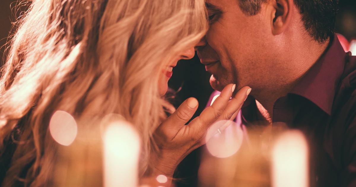 Romantic couple sharing an intimate moment on a date night, showing emotional and physical affection in a new relationship