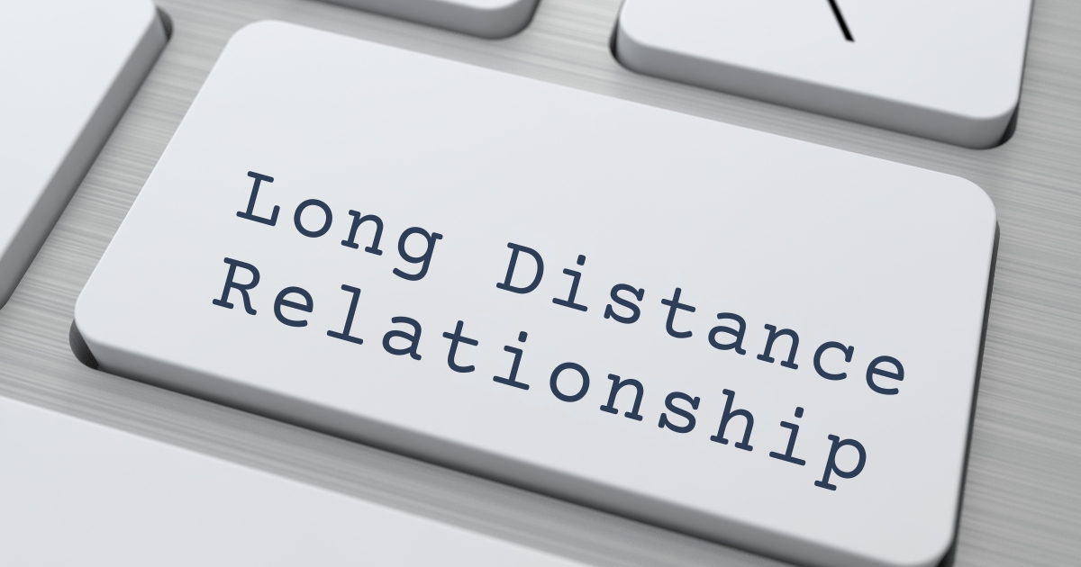 Close-up of a keyboard key labeled "Long Distance Relationship," symbolizing online communication and connection in remote relationships.