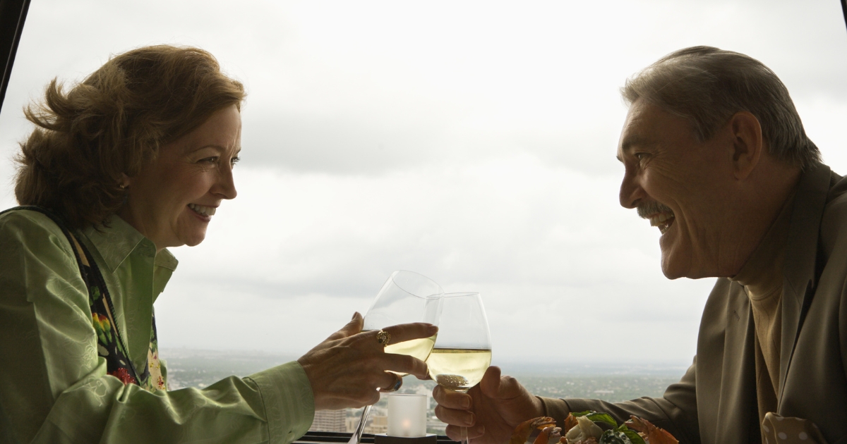 Dating in your 50s: older couple connecting over dinner and wine