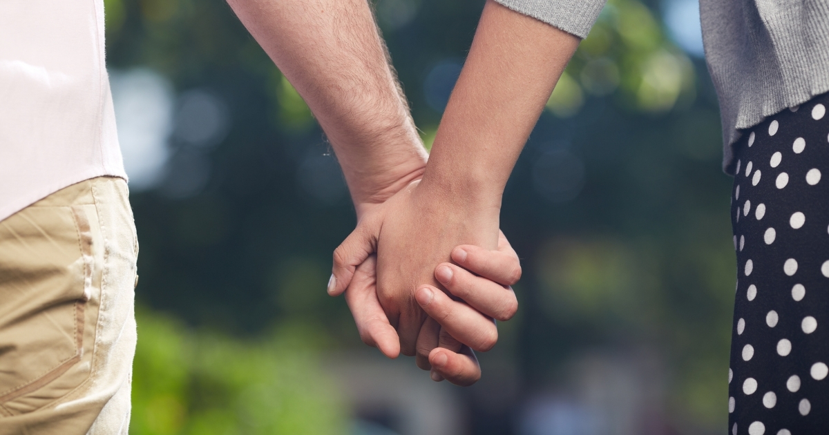 "Close-up of couple holding hands – symbolizing casual dating over 50"