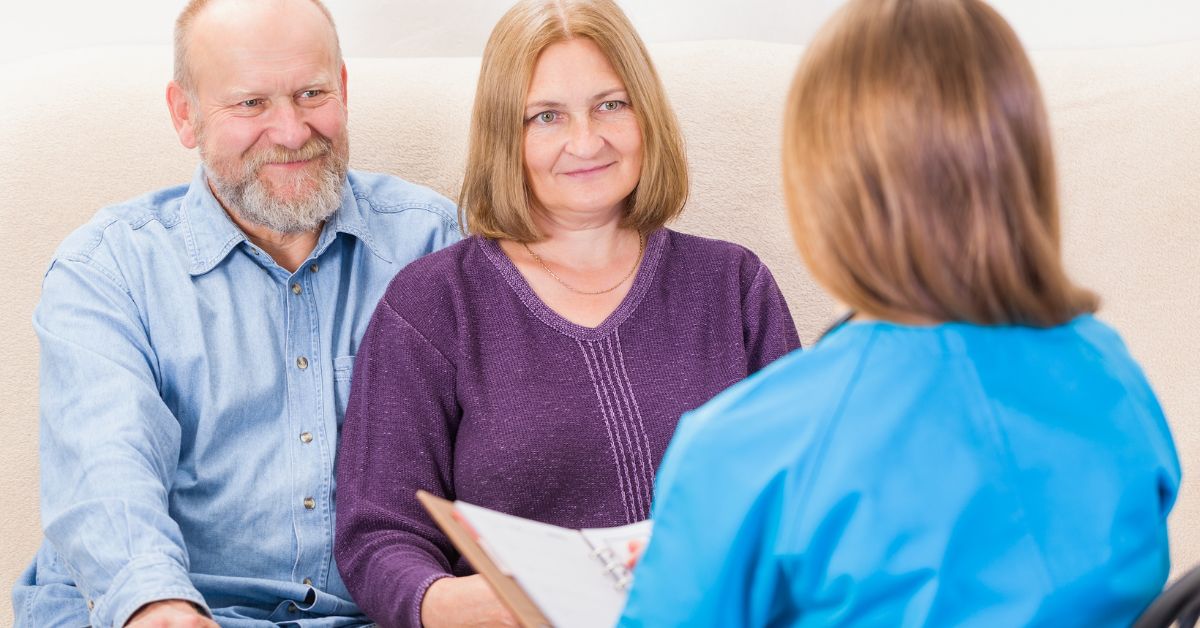 Senior couple attending a counseling session with a therapist, symbolizing the benefits of couples therapy.