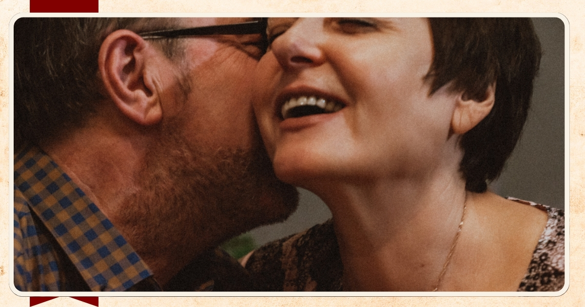 Happy mature couple sharing an intimate and playful moment together, exploring emotional and romantic connection over 50