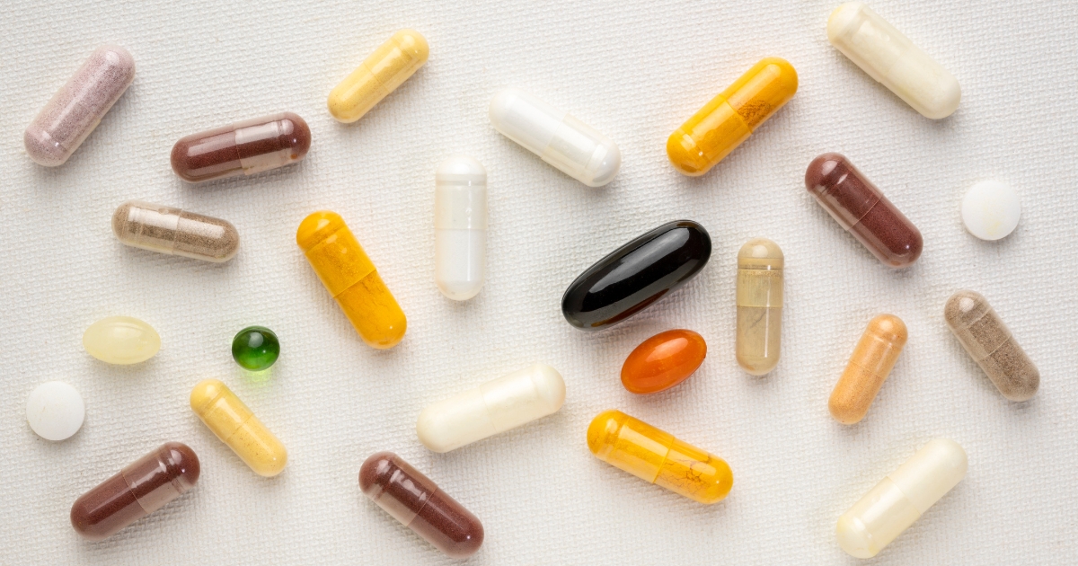 Keeping Young With Vitamins_ Which Ones Should You Be Taking - Mature Singles Finding Love Assorted vitamin and supplement capsules on a white background, representing anti-aging and midlife health support.