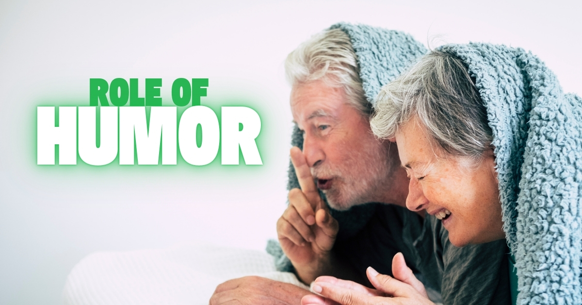 Laughing Together Again_ The Role of Humor in Mature Relationships - Mature Singles Finding Love Happy older couple laughing under a blanket, illustrating the role of humor in mature relationships.