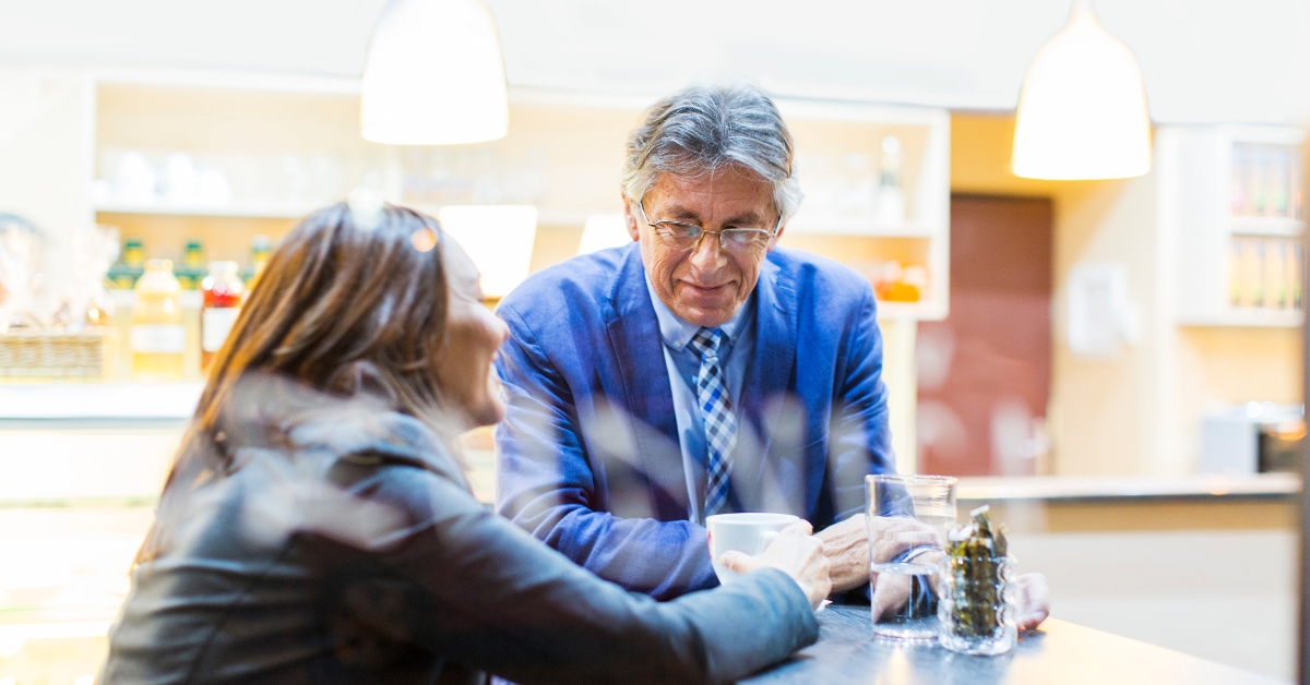 Navigating the First Date_ Dos and Donts for a Great Impression - Mature Singles Finding Love Mature couple enjoying a conversation over coffee during a first date.
