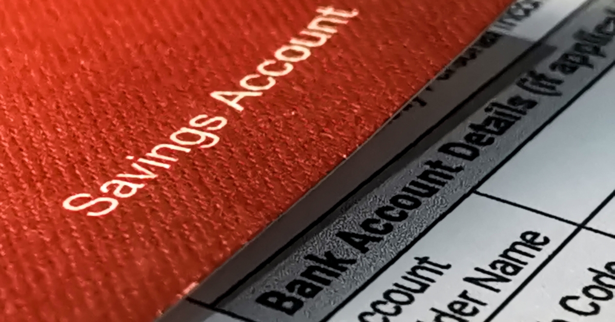 Relationship Finances_ Should You Share A Bank Account - Mature Singles Finding Love Banking essentials: savings account passbook and financial documents.