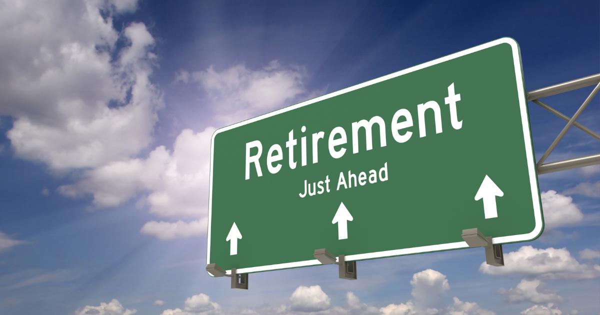 The Impact of Retirement on Your Romantic Relationship - Mature Singles Finding Love A green highway sign reading 'Retirement Just Ahead' with arrows pointing forward, set against a blue sky with clouds, symbolizing the approach of retirement.