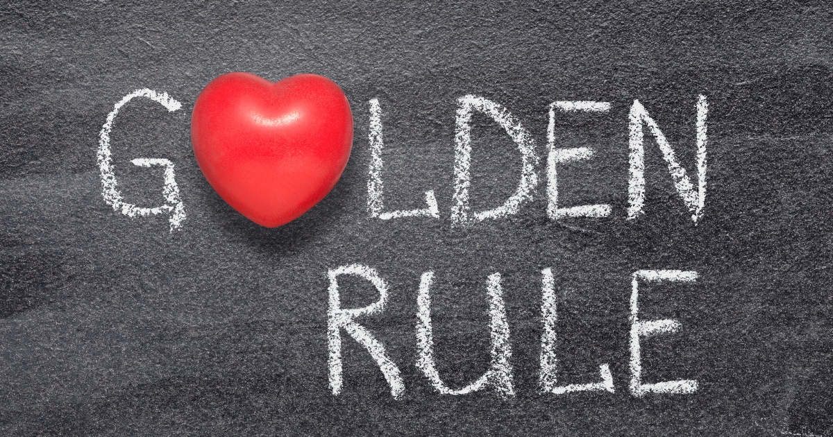 The Modern Rules of Dating for Singles Over 60 - Mature Singles Finding Love The phrase “Golden Rule” written in white chalk on a blackboard, with a red heart symbol replacing the letter “O” in the word “Golden.”