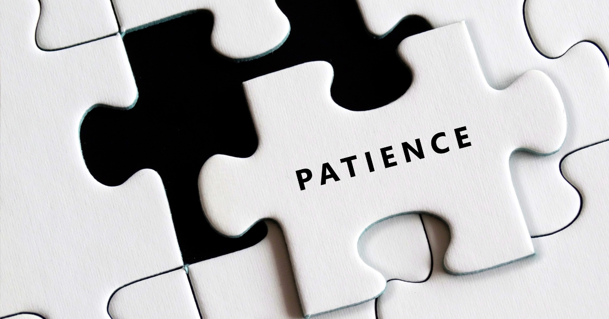 The Power Of Patience In Finding Love After 50 - Mature Singles Finding Love A white puzzle piece with the word 'PATIENCE' placed over a missing spot in a puzzle, symbolizing the importance of patience in relationships and personal growth.